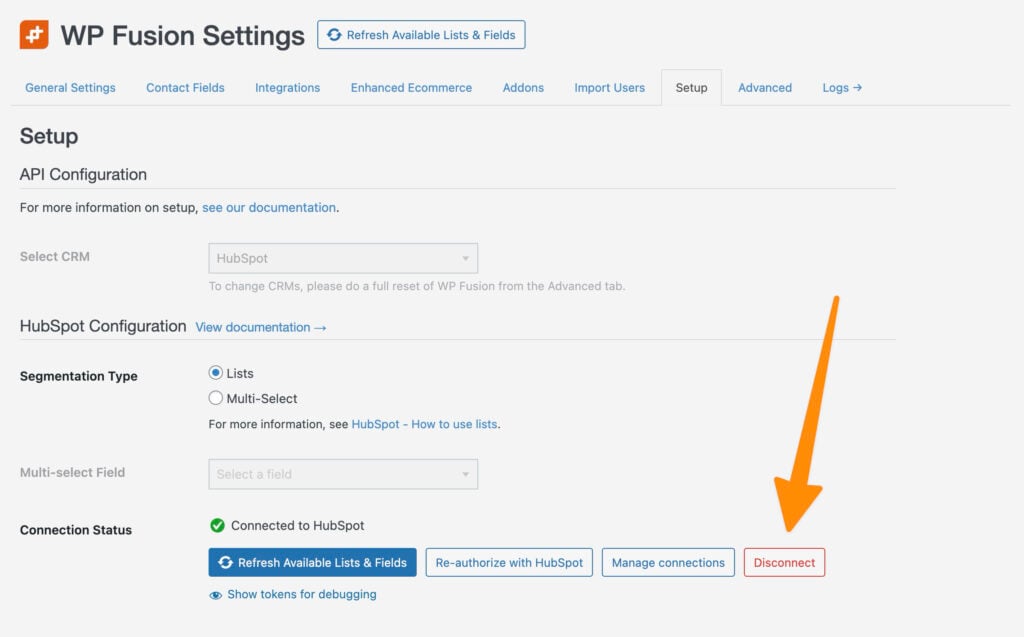 screenshot of the wp fusion settings page in wordpress showing hubspot configuration. an orange arrow points to a red “disconnect” button next to the “manage connections” and “re authorize with hubspot” buttons.