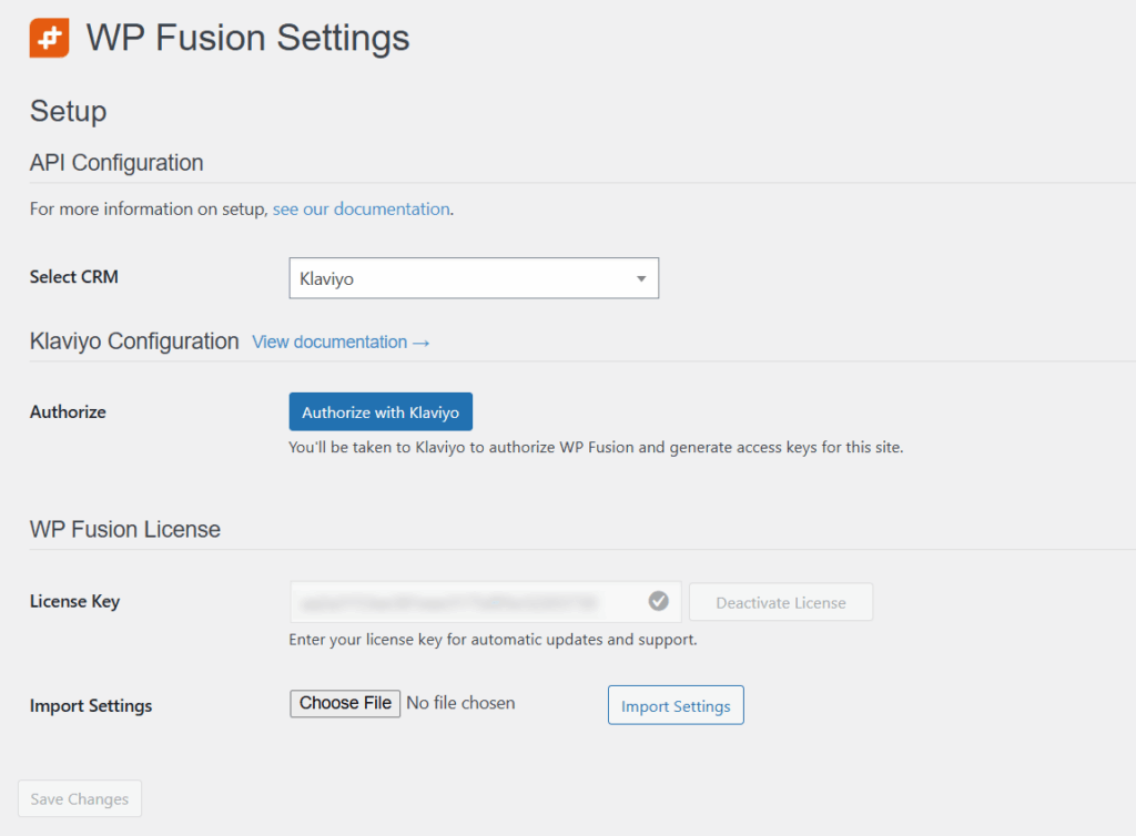 screenshot of the wp fusion settings page in wordpress, showing api configuration to connect with your crm, a blue “authorize with klaviyo” button, license key entry, and an option to import settings via file upload.